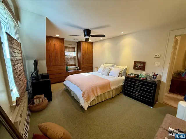 a bedroom with a bed and furniture