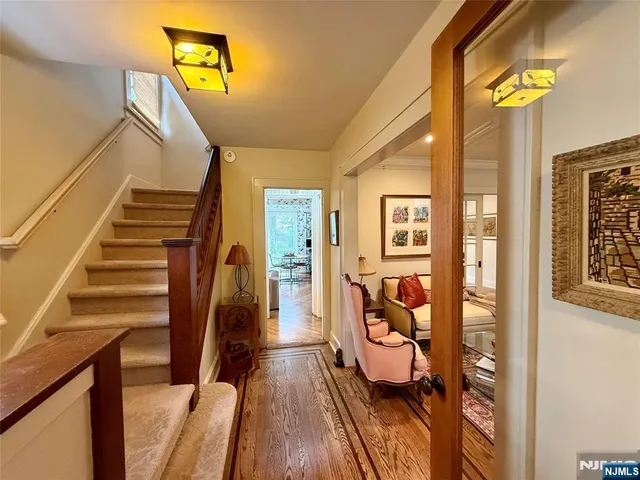 a view of an entryway with wooden floor