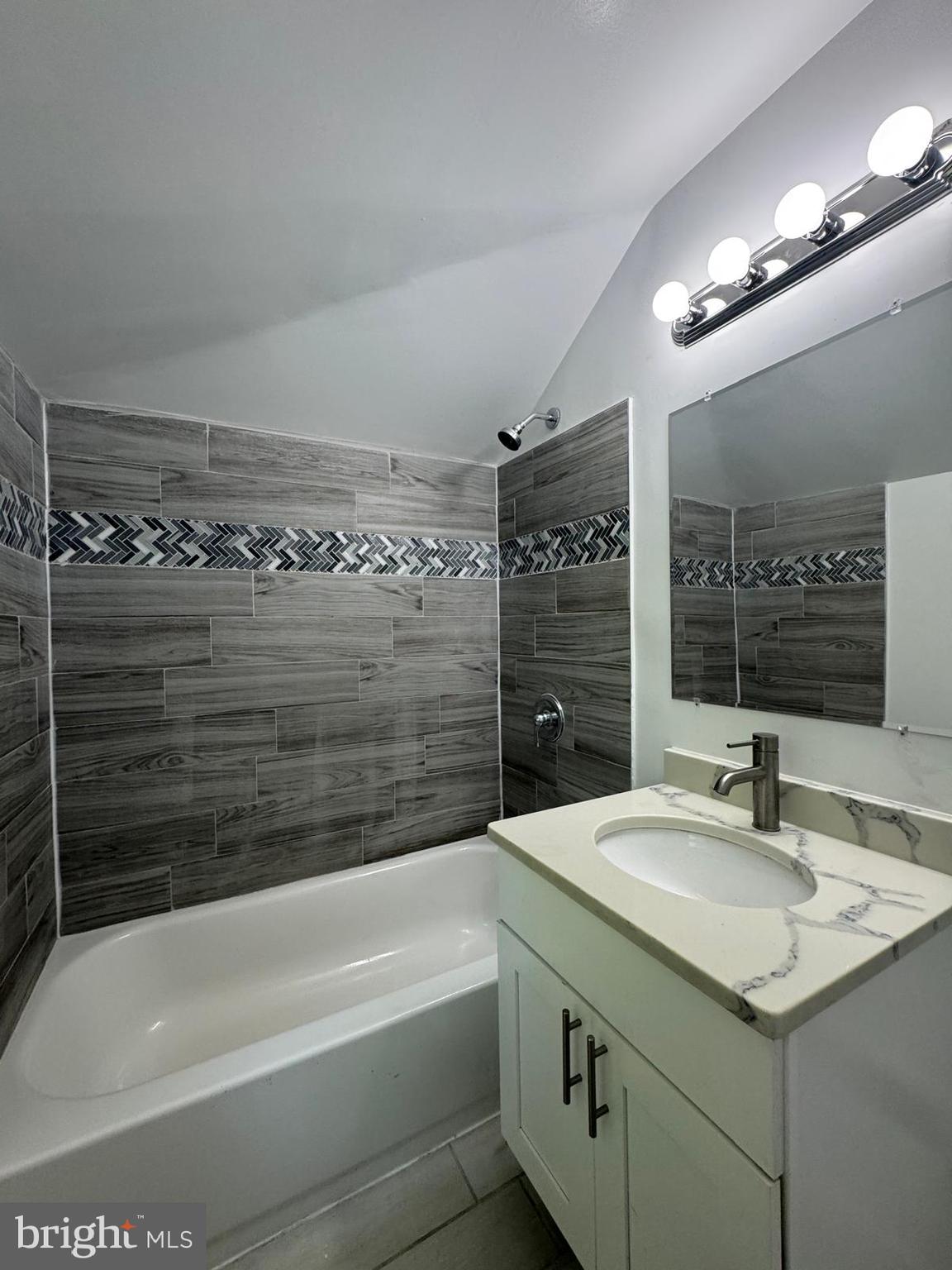 5735 Euclid Street Landover, MD 20785 - Photo 12 of 14 a bathroom with a bathtub and a sink