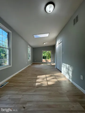 a view of a livingroom with wooden floor