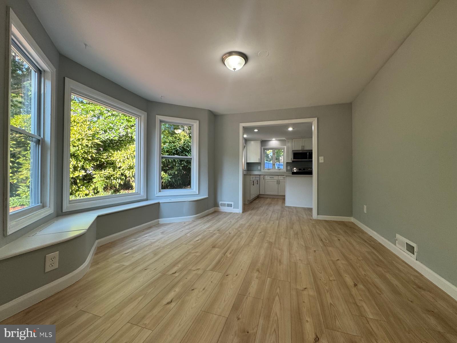 5735 Euclid Street Landover, MD 20785 - Photo 3 of 14 a view of empty room with wooden floor and fan
