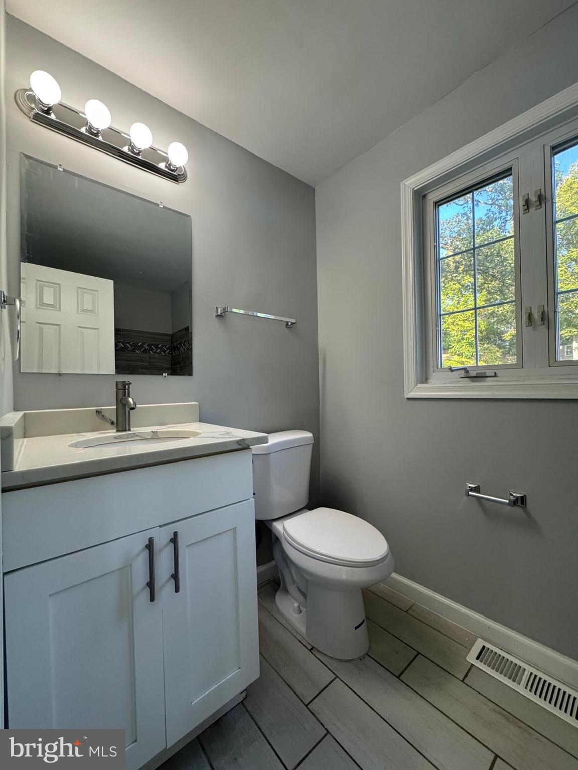 5735 Euclid Street Landover, MD 20785 - Photo 4 of 14 a bathroom with a sink toilet and a mirror