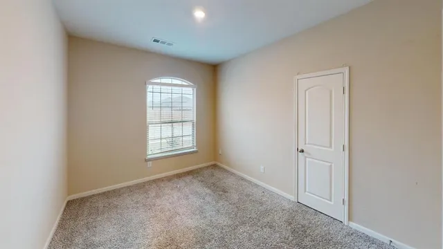 a bathroom with a toilet and bathtub