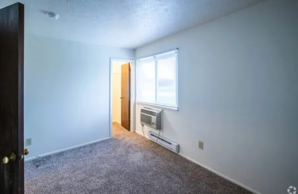 a view of an empty room with a window