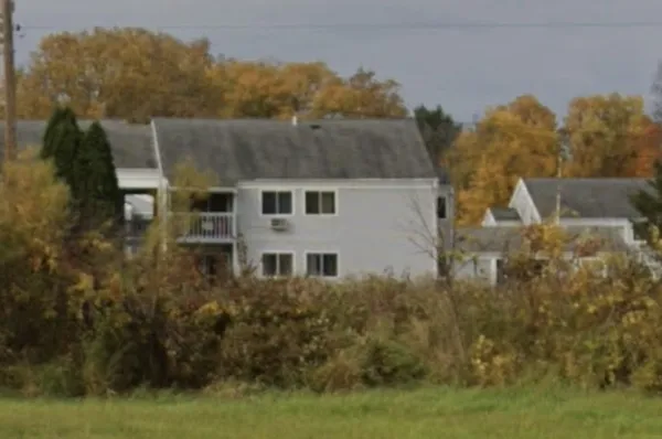 a aerial view of a house with a yard