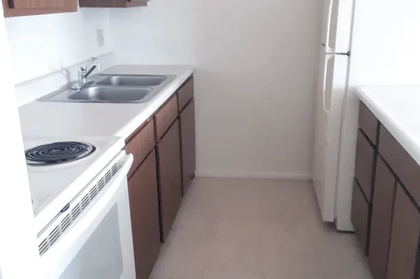 a kitchen with a sink and stove