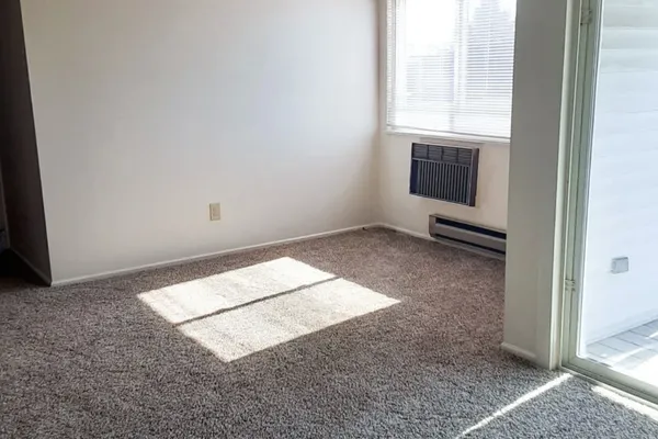 a view of an empty room and window