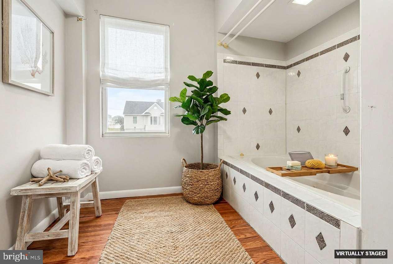 2810 & 2810-a 12th Street Baltimore, MD 21219 - Photo 10 of 67 a spacious bedroom with a bed and a window