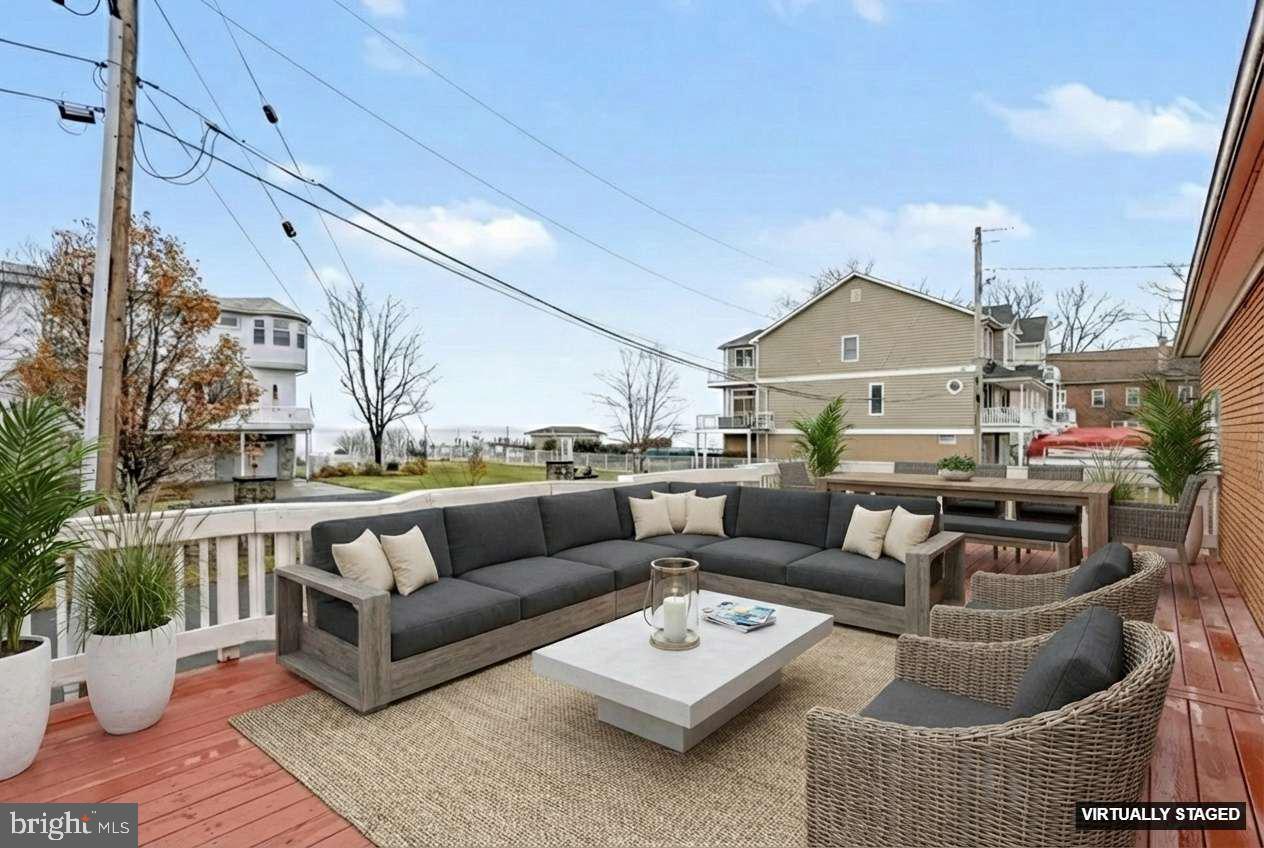 2810 & 2810-a 12th Street Baltimore, MD 21219 - Photo 14 of 67 a living room with furniture and a chandelier