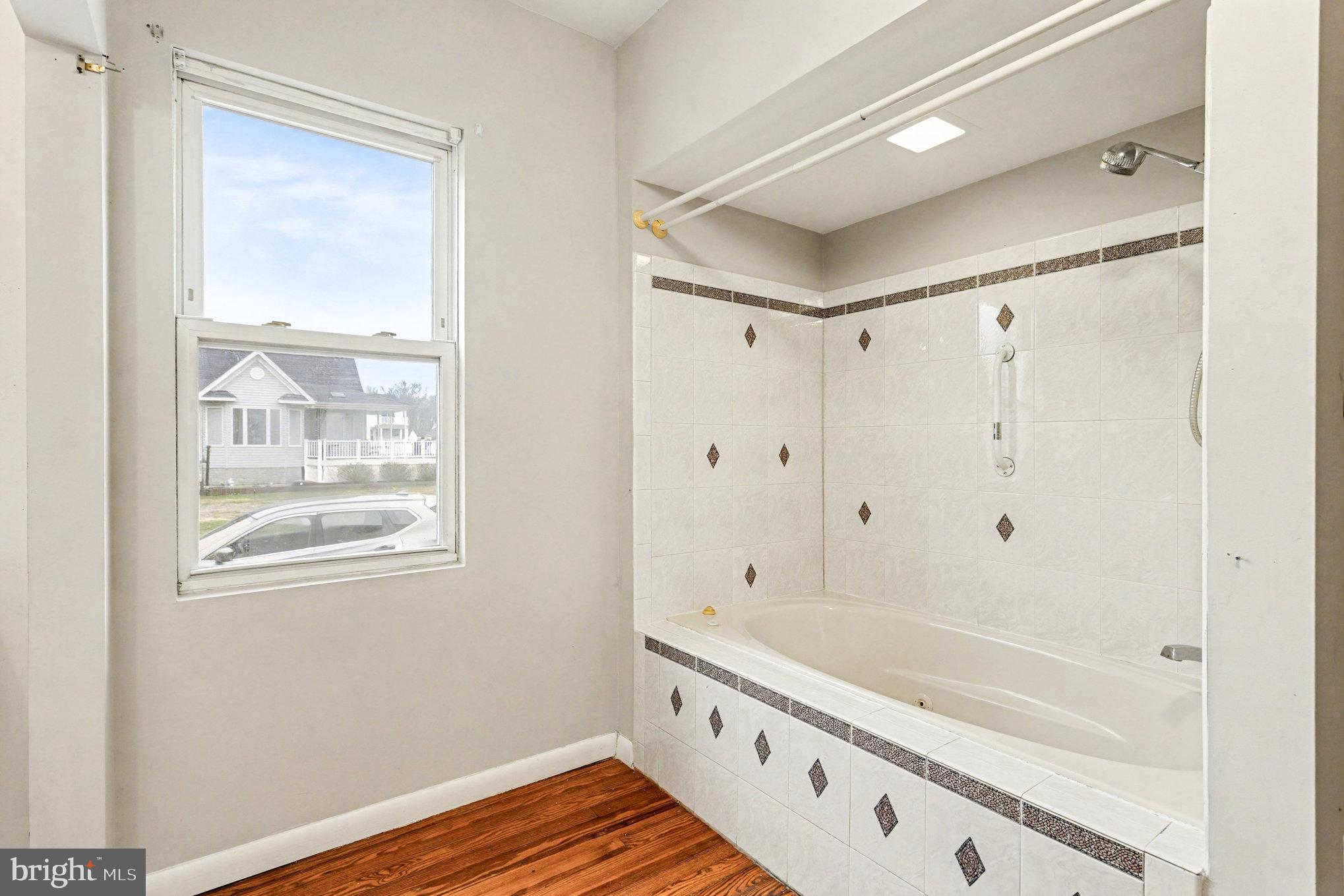 2810 & 2810-a 12th Street Baltimore, MD 21219 - Photo 26 of 67 a bathroom with a bathtub and a shower