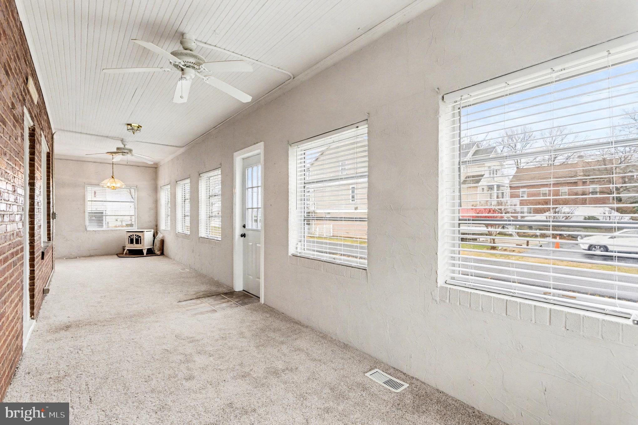 2810 & 2810-a 12th Street Baltimore, MD 21219 - Photo 29 of 67 a view of a livingroom with a ceiling fan and window