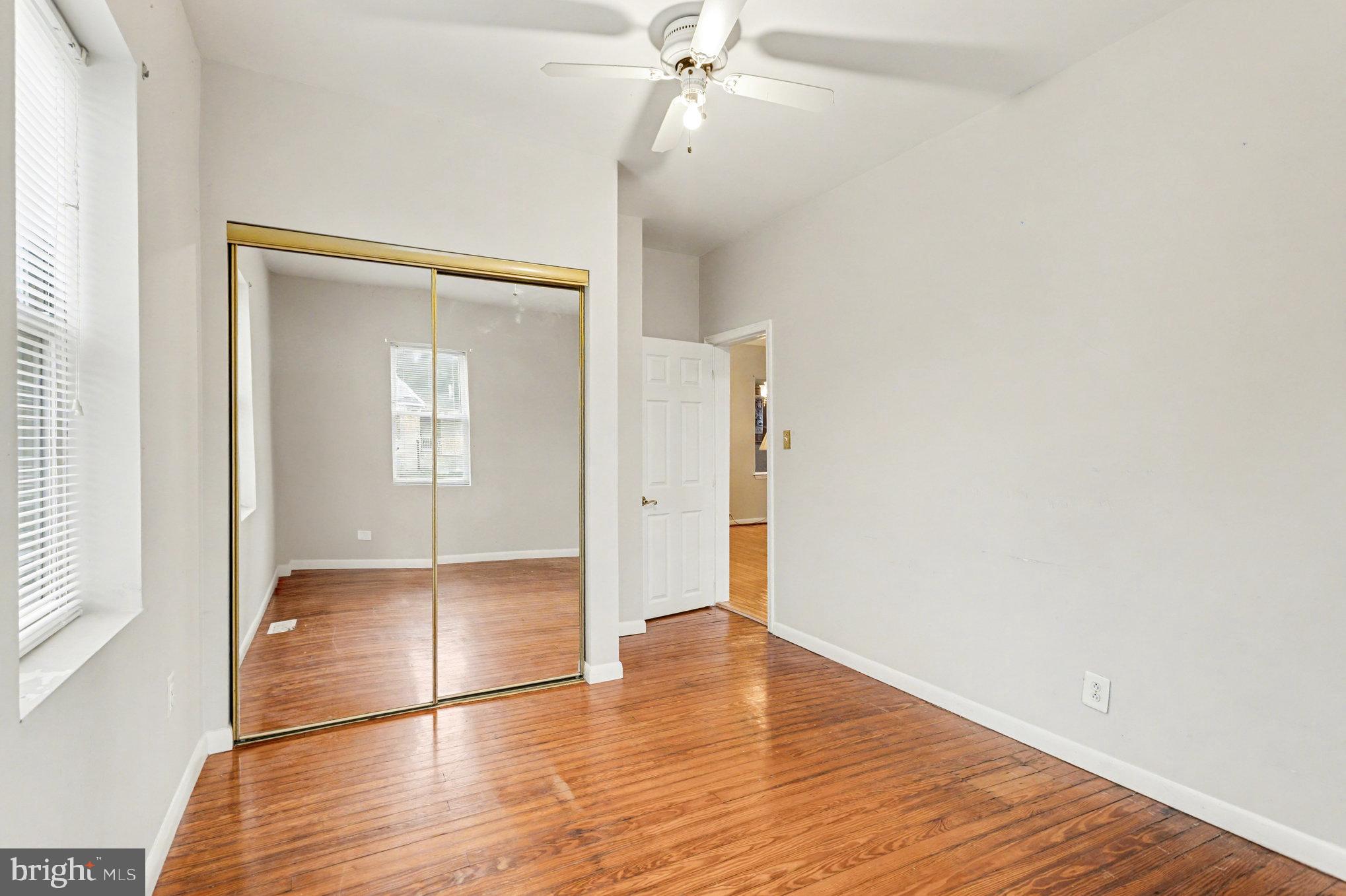 2810 & 2810-a 12th Street Baltimore, MD 21219 - Photo 30 of 67 an empty room with wooden floor and cabinet