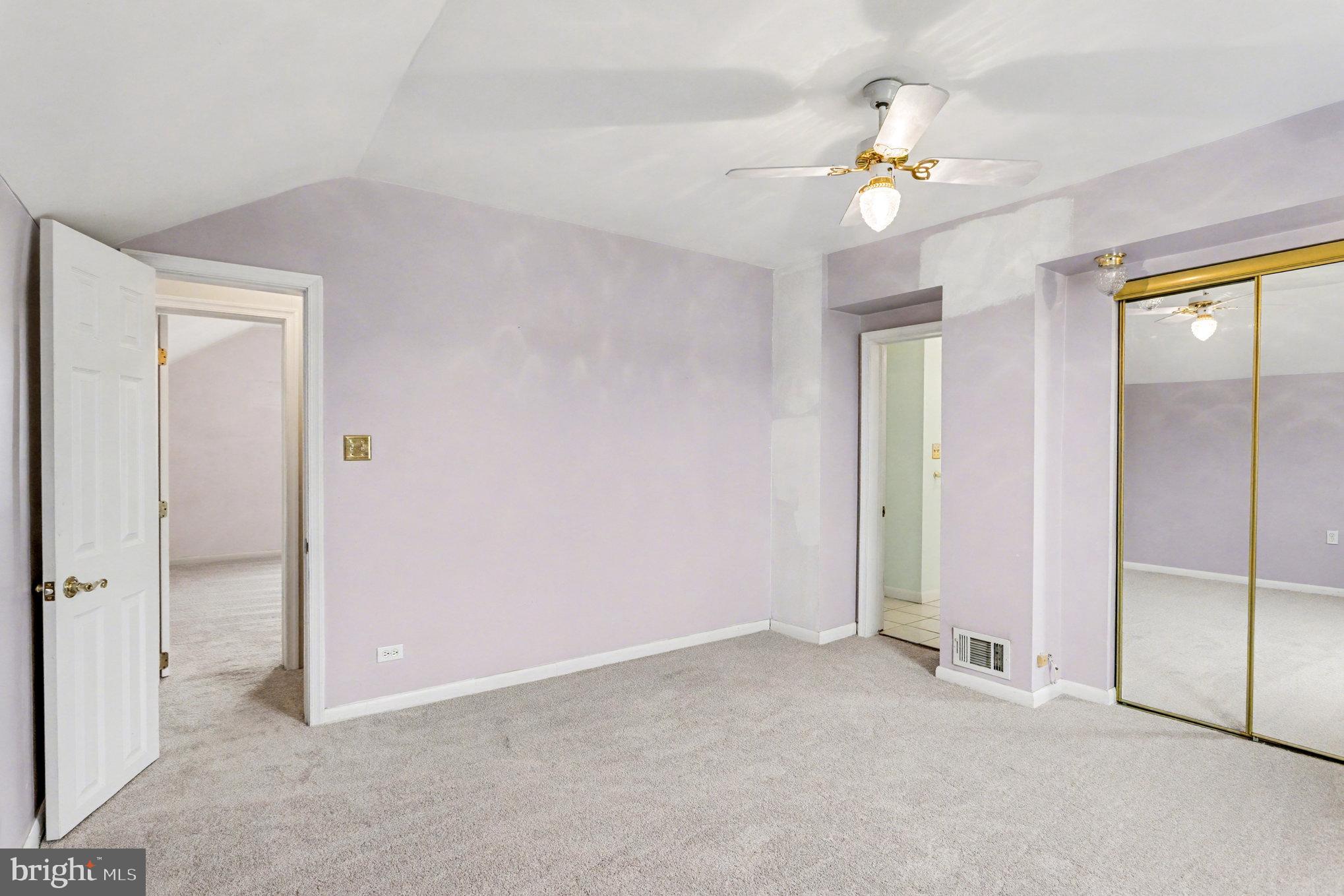 2810 & 2810-a 12th Street Baltimore, MD 21219 - Photo 31 of 67 a view of an empty room with a chandelier fan