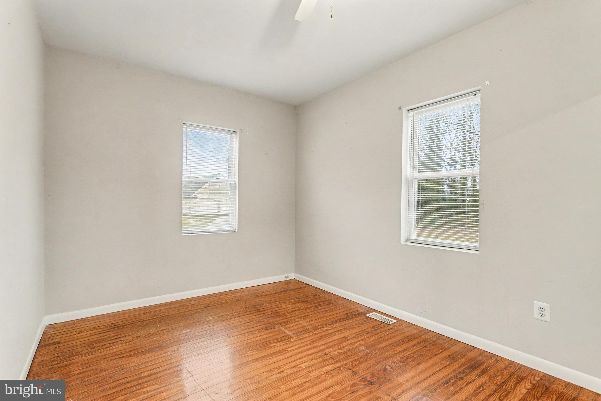 2810 & 2810-a 12th Street Baltimore, MD 21219 - Photo 32 of 67 a view of a room with wooden floor and windows