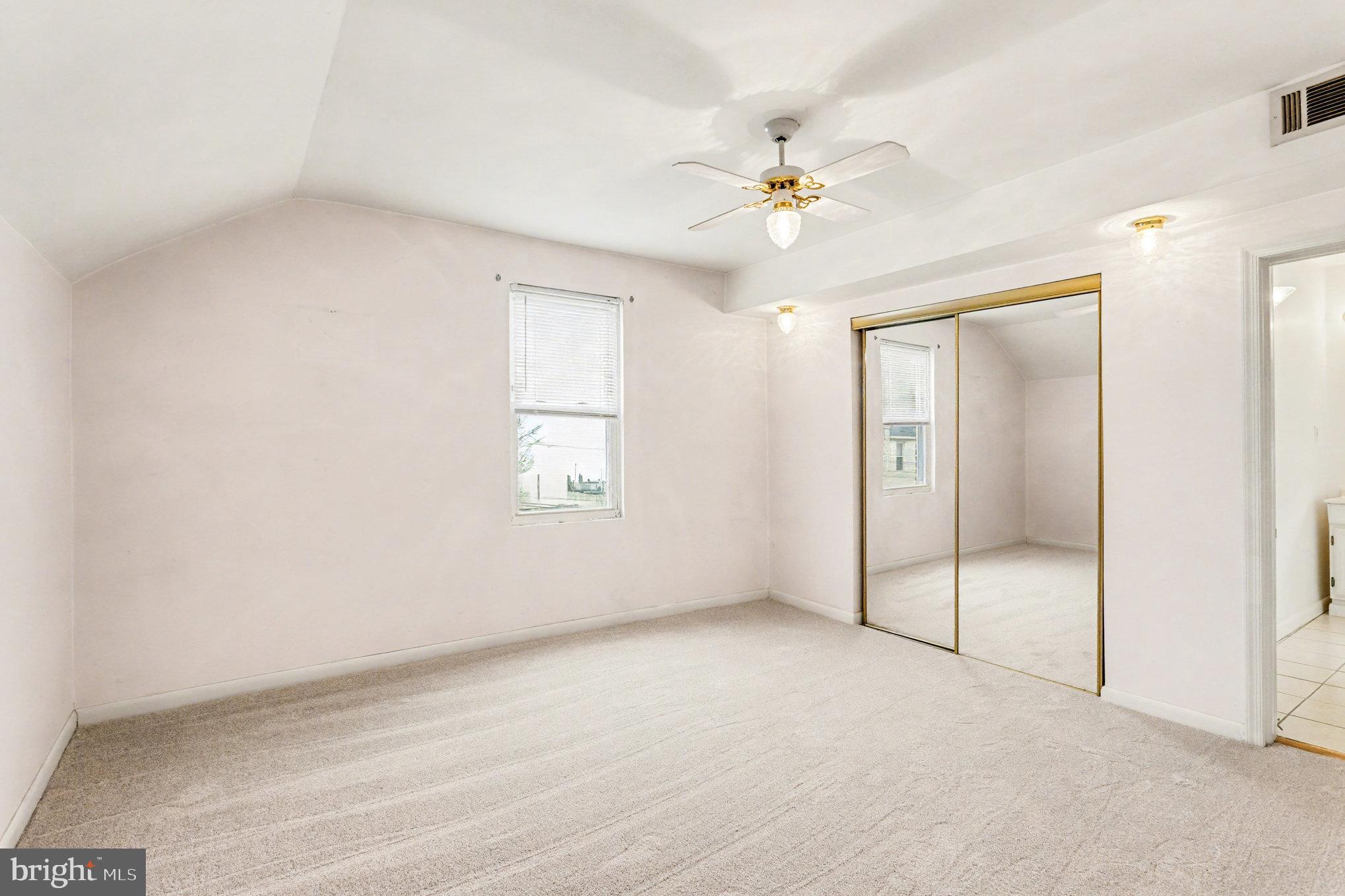 2810 & 2810-a 12th Street Baltimore, MD 21219 - Photo 37 of 67 an empty room with fan and windows