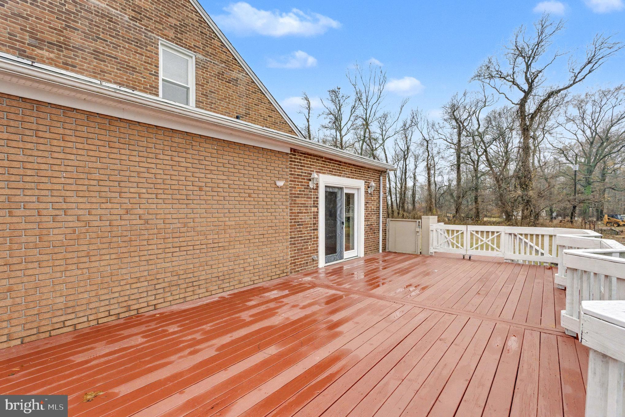 2810 & 2810-a 12th Street Baltimore, MD 21219 - Photo 40 of 67 a view of backyard with a deck and wooden floor