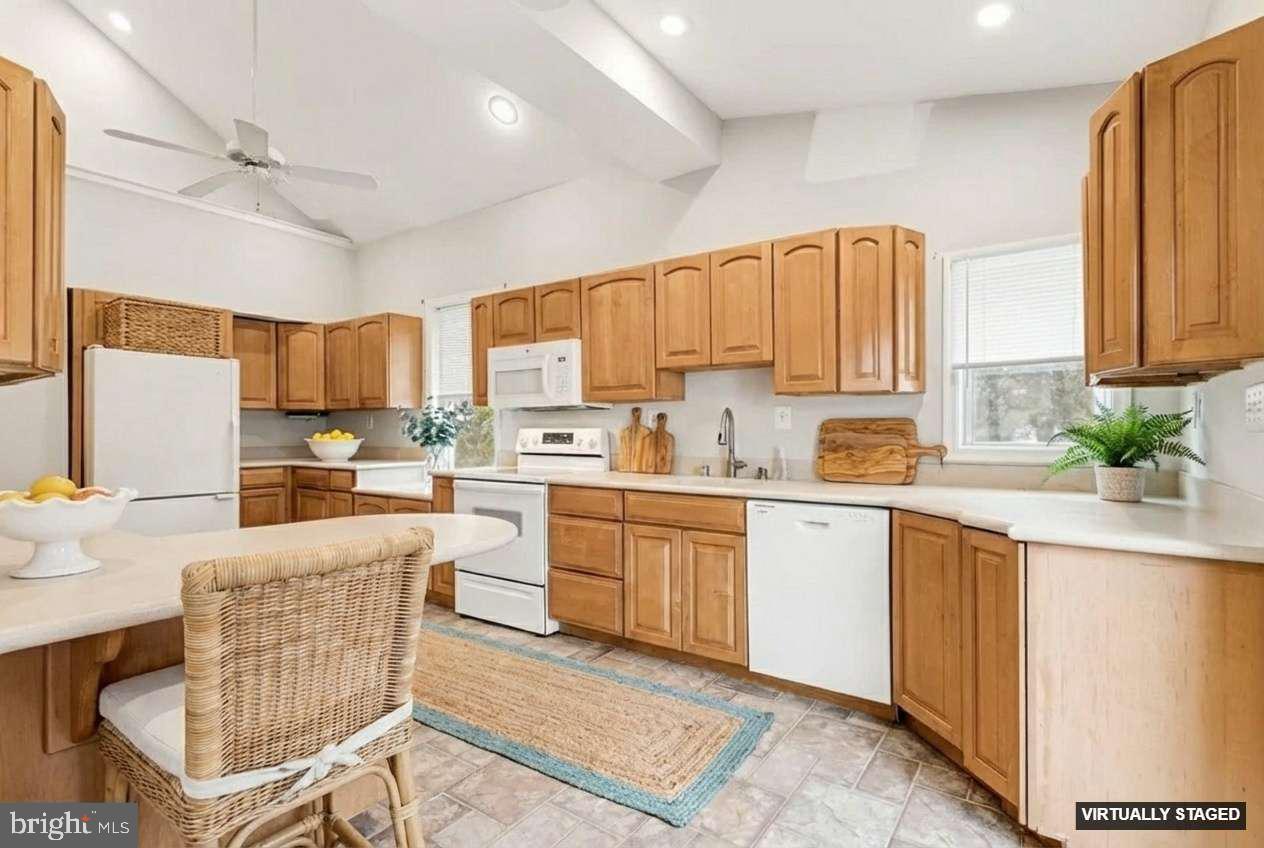 2810 & 2810-a 12th Street Baltimore, MD 21219 - Photo 6 of 67 a kitchen with a sink window and cabinets