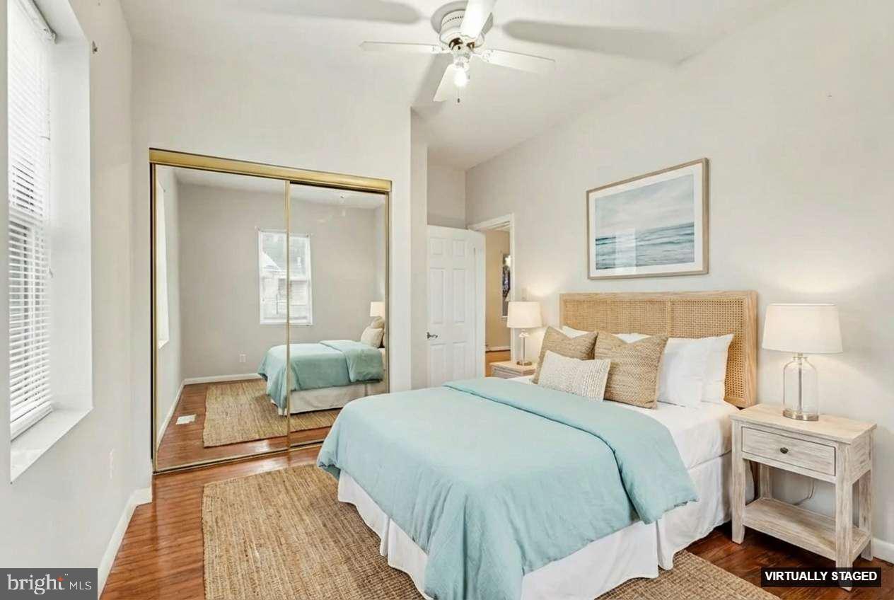 2810 & 2810-a 12th Street Baltimore, MD 21219 - Photo 9 of 67 a bedroom with a bed and a chandelier