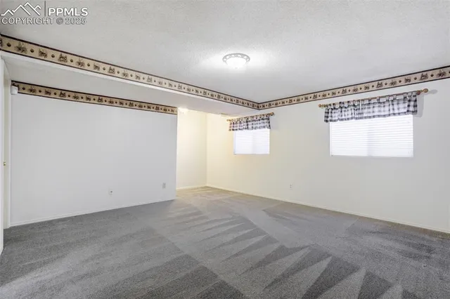 an empty room with an entrance to other room