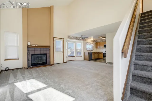 a view of an empty room with a fireplace