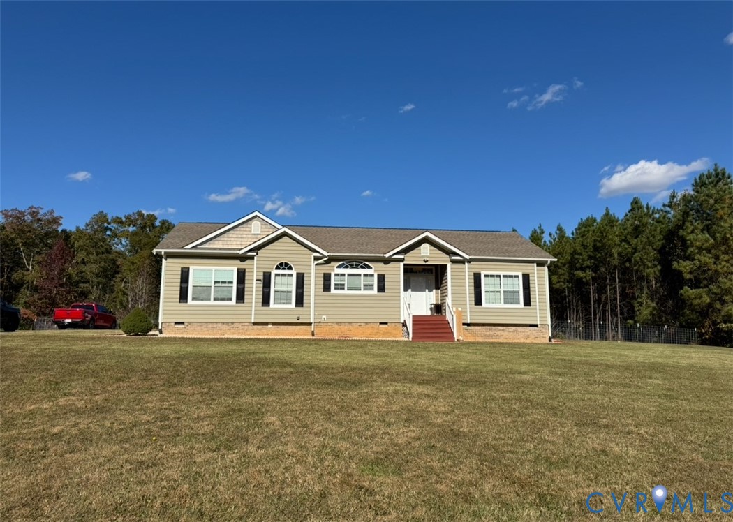 12232 Cedar Lane Ashland, VA 23005 - Photo 1 of 18 a front view of a house with a yard