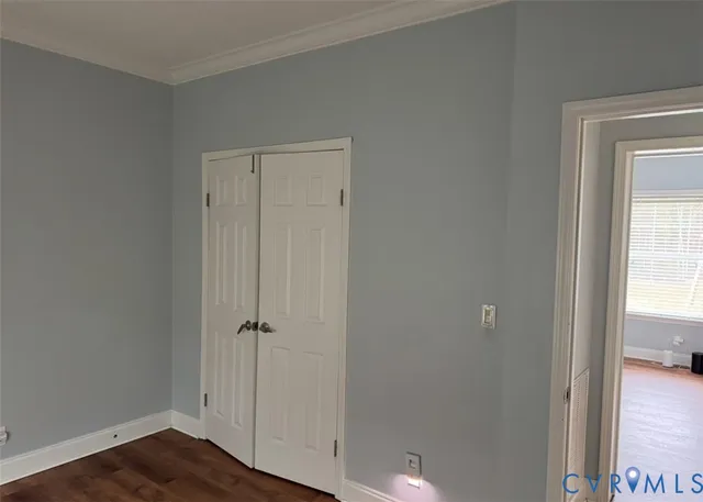 a view of room with wooden floor