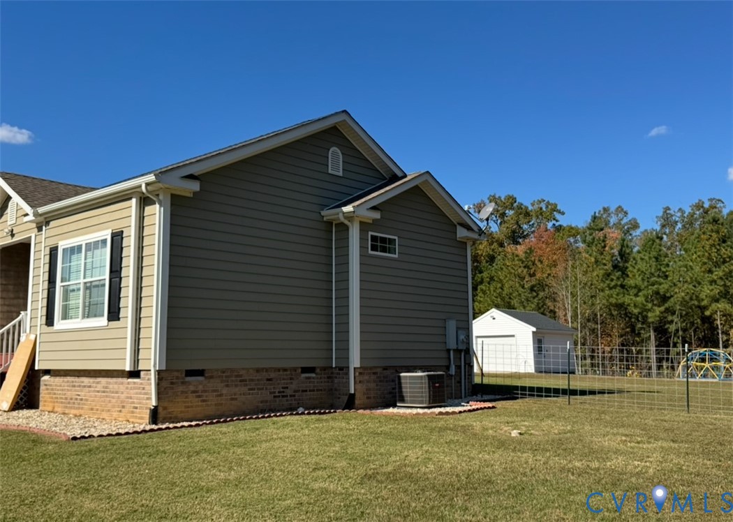 12232 Cedar Lane Ashland, VA 23005 - Photo 4 of 18 a front view of a house with a yard