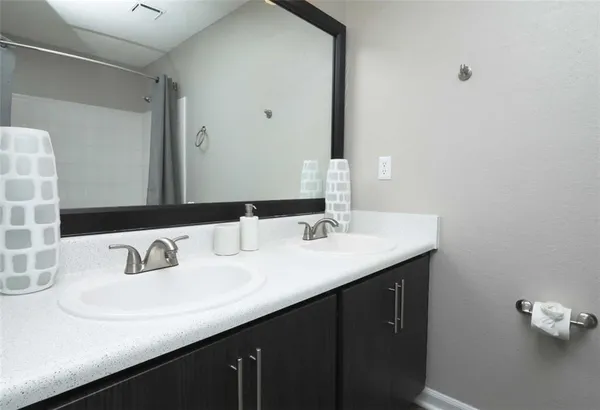 a bathroom with a sink and a mirror