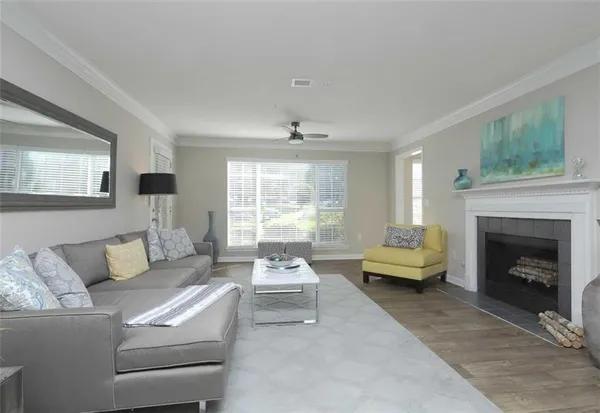 a living room with furniture and a fireplace