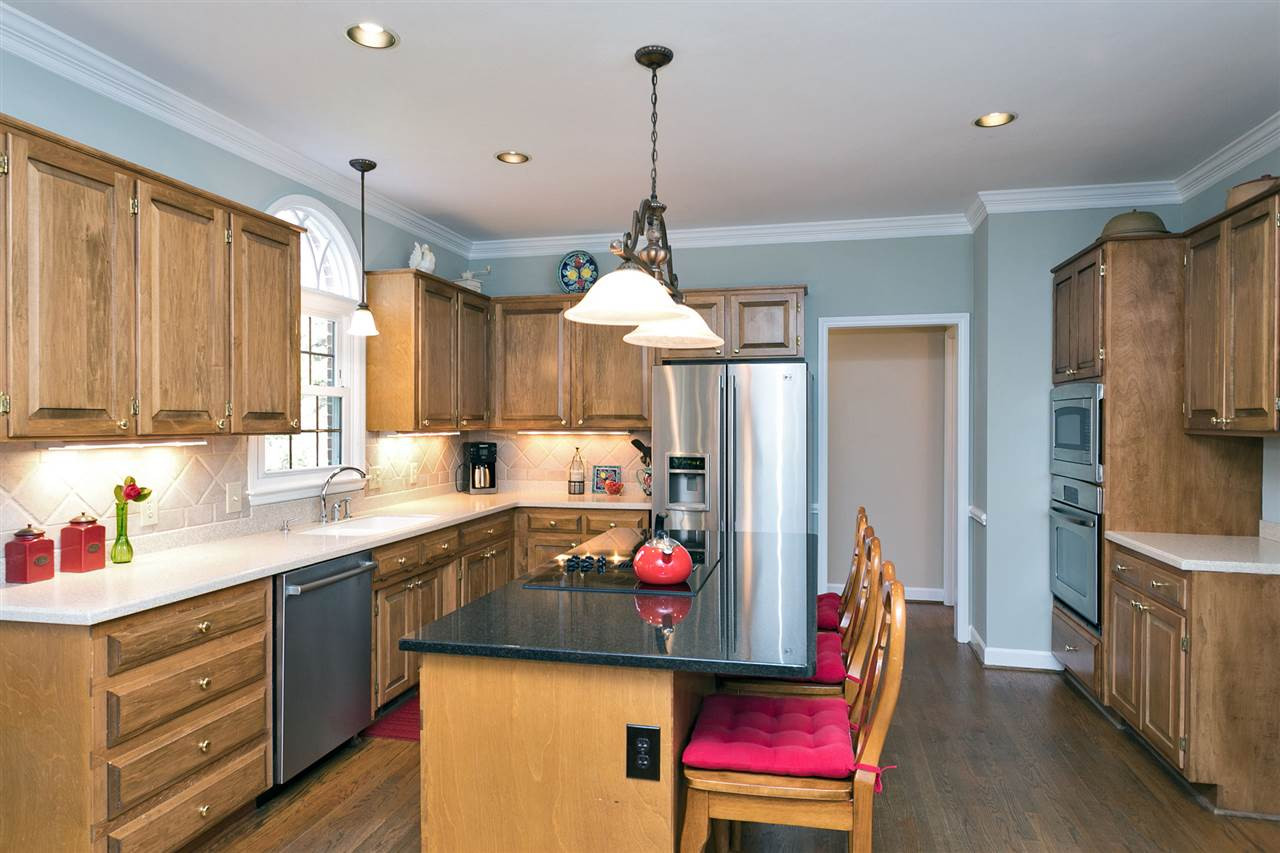 5309 Birchleaf Drive Raleigh, NC 27606 - Photo 11 of 23 New Granite Island and Cooktop