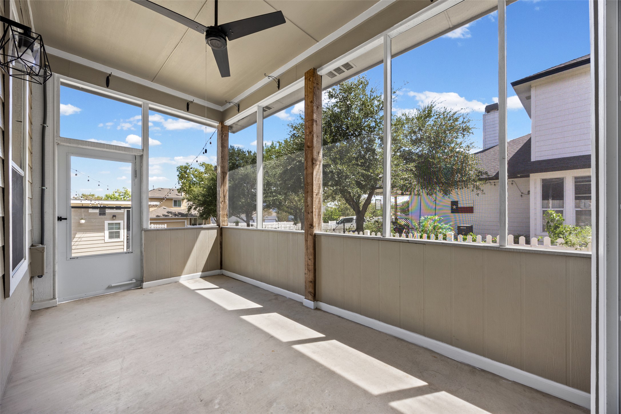 5881 Fergus Kyle, TX 78640 - Photo 30 of 40 An inviting screened porch features smooth concrete flooring and large windows opening to the backyard.