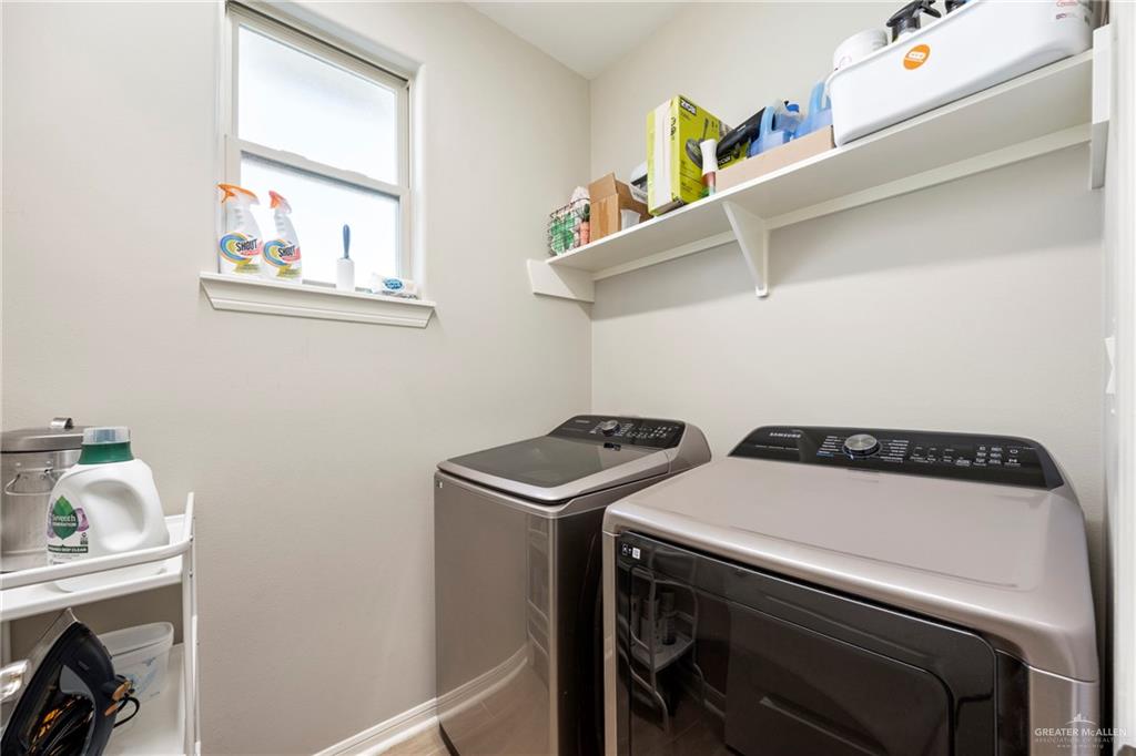 6332 Cascada Bnd Road McAllen, TX 78504 - Photo 12 of 18 a utility room with dryer and washer