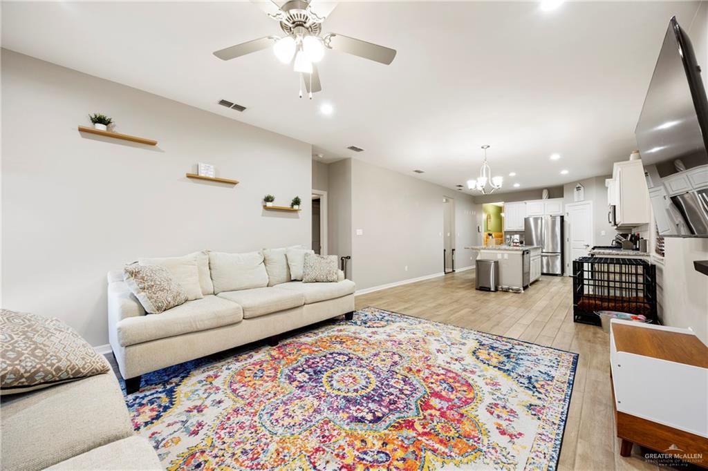 6332 Cascada Bnd Road McAllen, TX 78504 - Photo 2 of 18 a living room with furniture and a rug