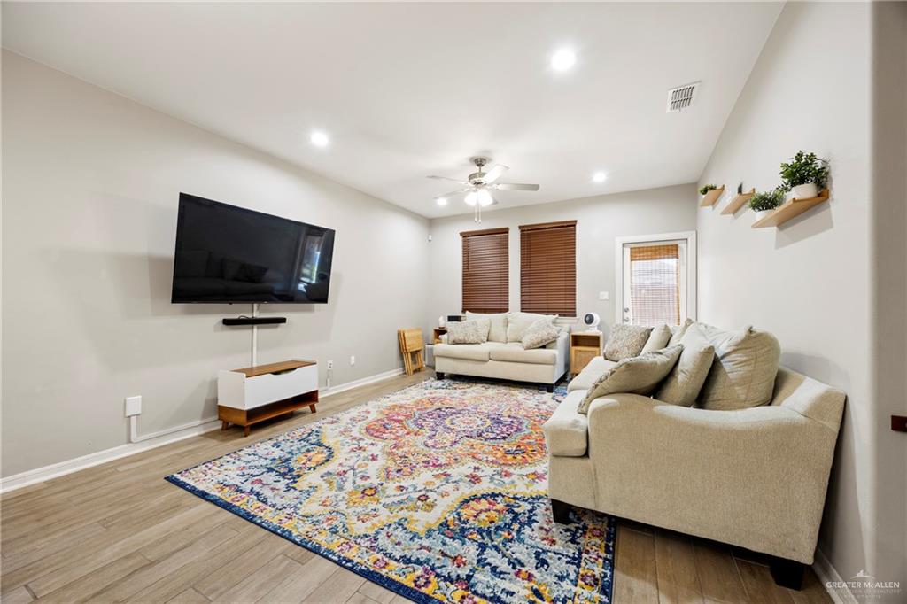6332 Cascada Bnd Road McAllen, TX 78504 - Photo 3 of 18 a living room with furniture and a flat screen tv