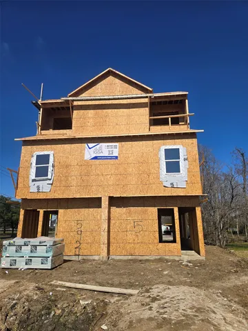a front view of a house with garage
