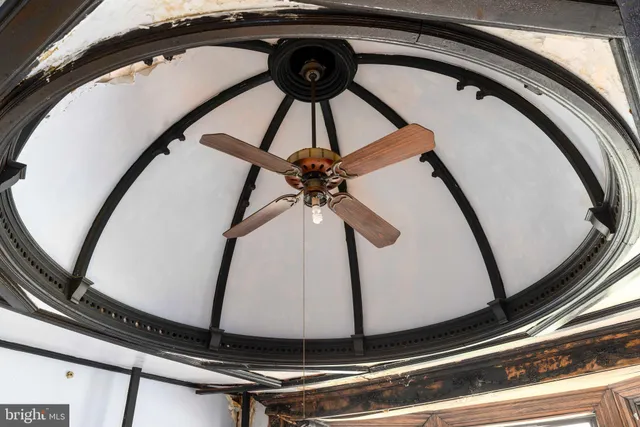 a view of staircase with white walls and a window