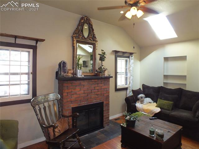 9405 Ute Road Cascade, CO 80809 - Photo 6 of 16 Fireplace and Vaulted Ceilings in the Living Room