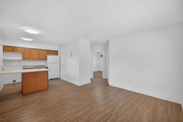 a view of kitchen with wooden floor