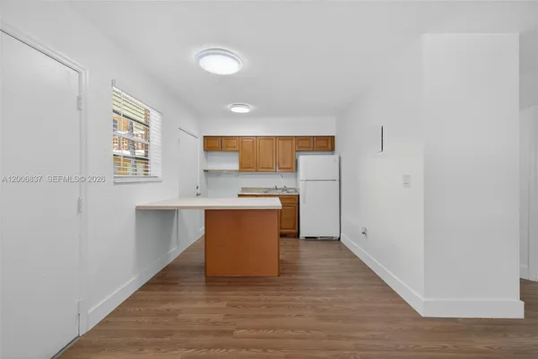 a view of kitchen with wooden floor
