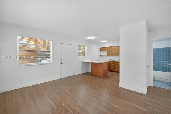 a view of kitchen with wooden floor