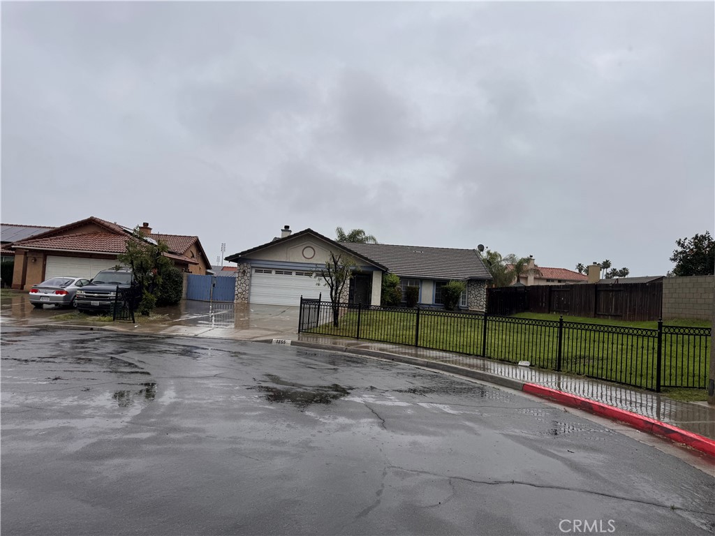 1255 Comiskey Court Perris, CA 92571 - Photo 2 of 3 a view of street along with house