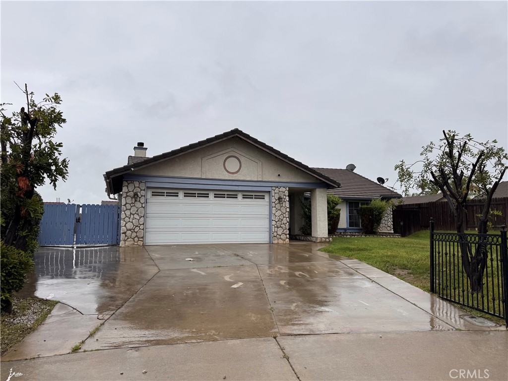 1255 Comiskey Court Perris, CA 92571 - Photo 3 of 3 a front view of a house with yard
