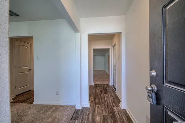 a view of a livingroom from a hallway