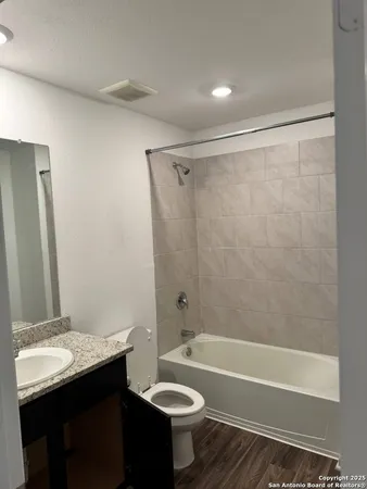 a bathroom with a sink a toilet and a bathtub