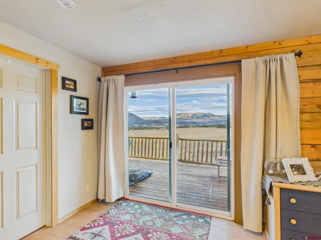 a view of a balcony with wooden floor
