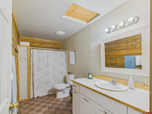 a bedroom with a bed and a closet