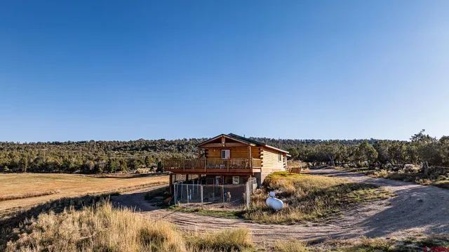 a view of a lake with a house in the background