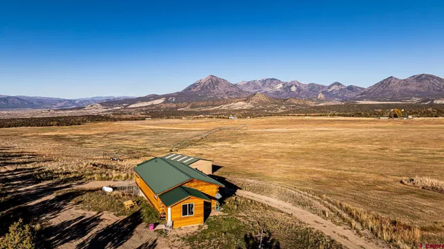 a view of an ocean and a mountain