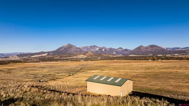 a view of an ocean and a mountain