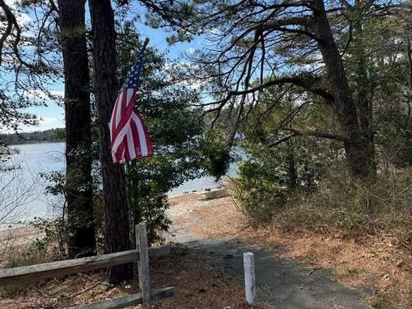 a living room with furniture a fireplace and windows